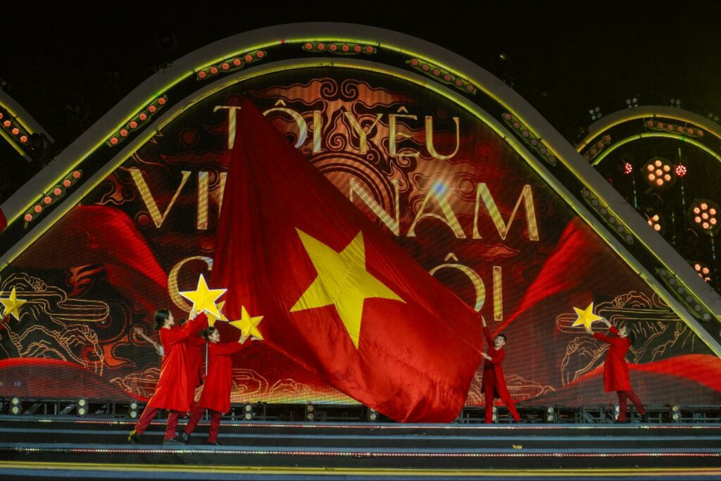 The riverside stage glows as the countdown begins